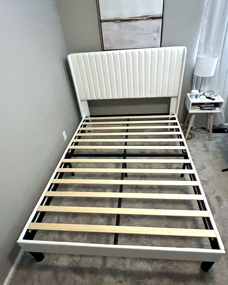 Assembled upholstered bed frame with slats
